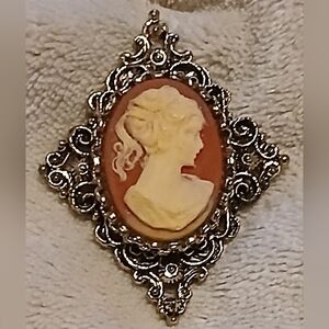 Elegant Cameo Brooch with Gold Accents